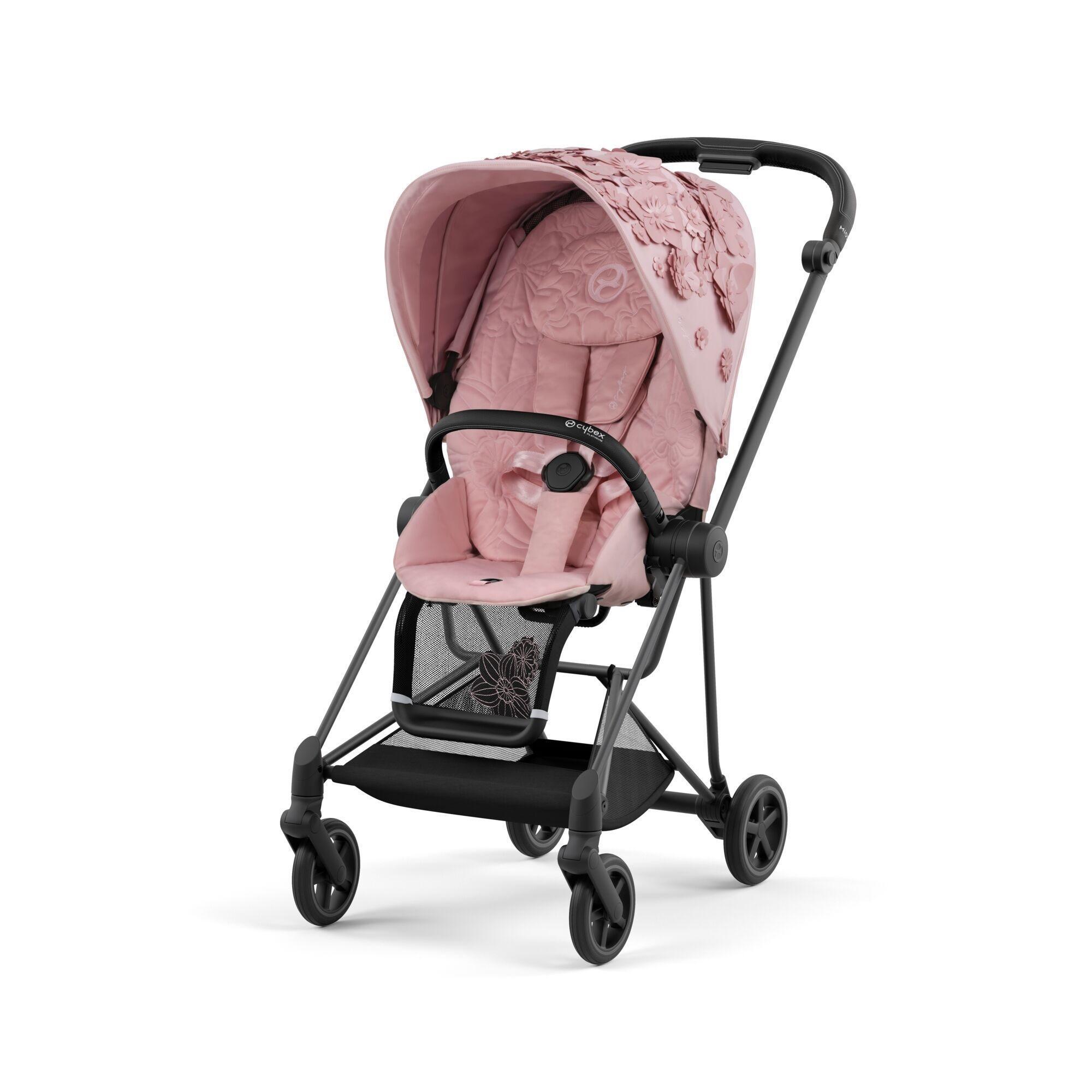 pink parent facing pushchair